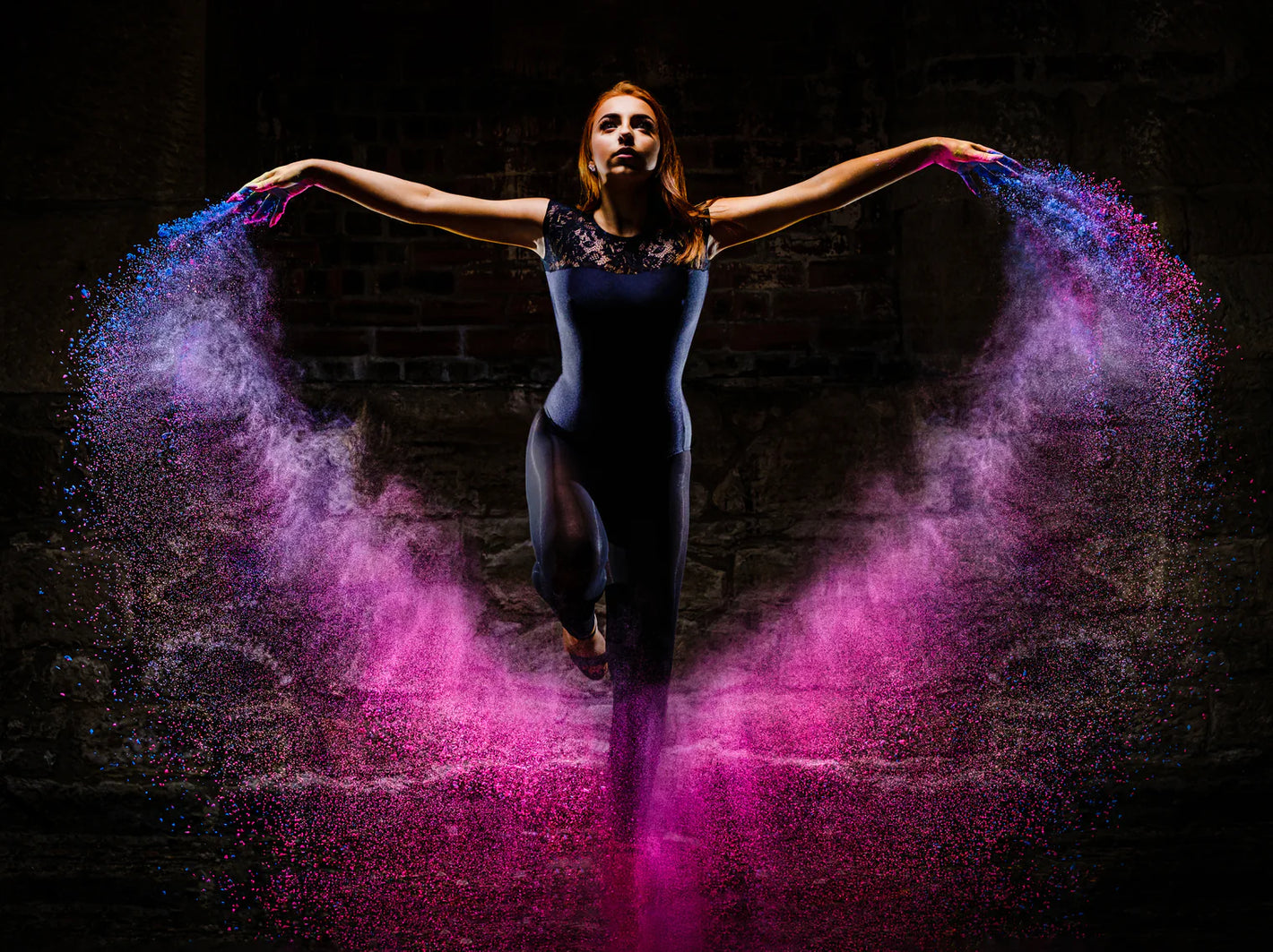 Photo of woman surrounded by colorful light, taken by photographer Kevin Wyllie