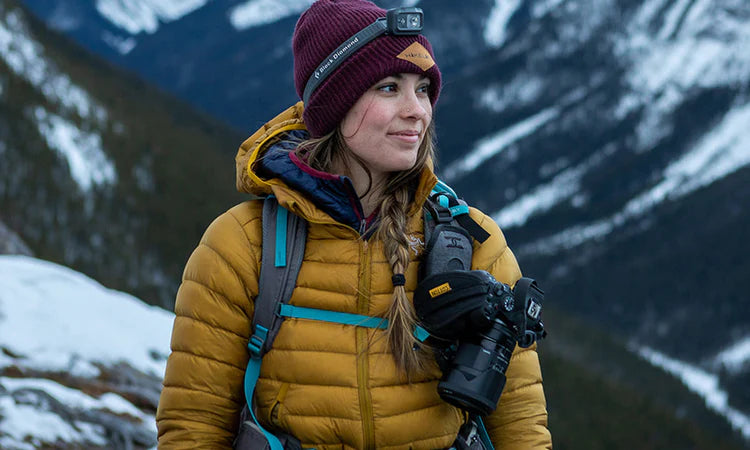 Woman hiking with a Cotton Camera Carrying Systems holster - also known as a Cotton Carrier - with the best warranty