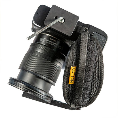 Cotton carrier hand camera strap attaching to bottom of camera body