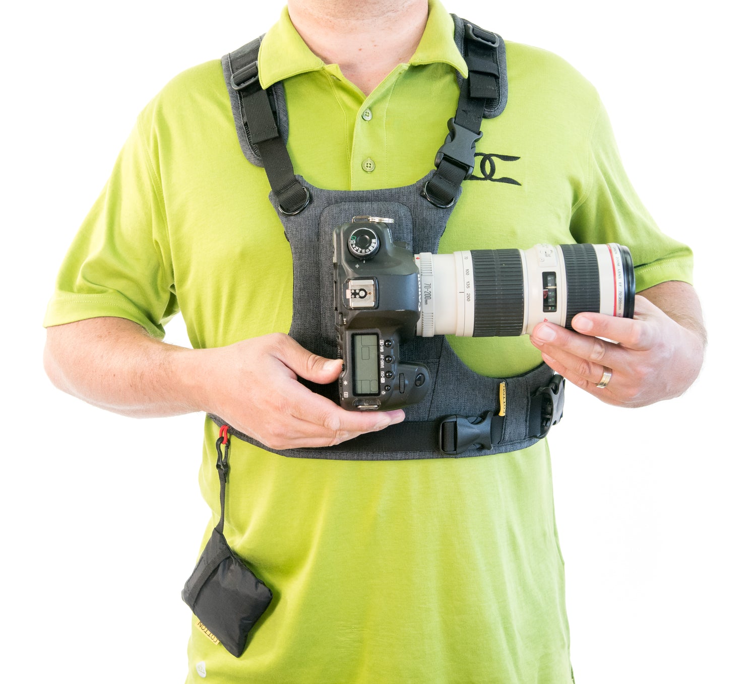 Man wearing a G3 camera harness with one camera being attached