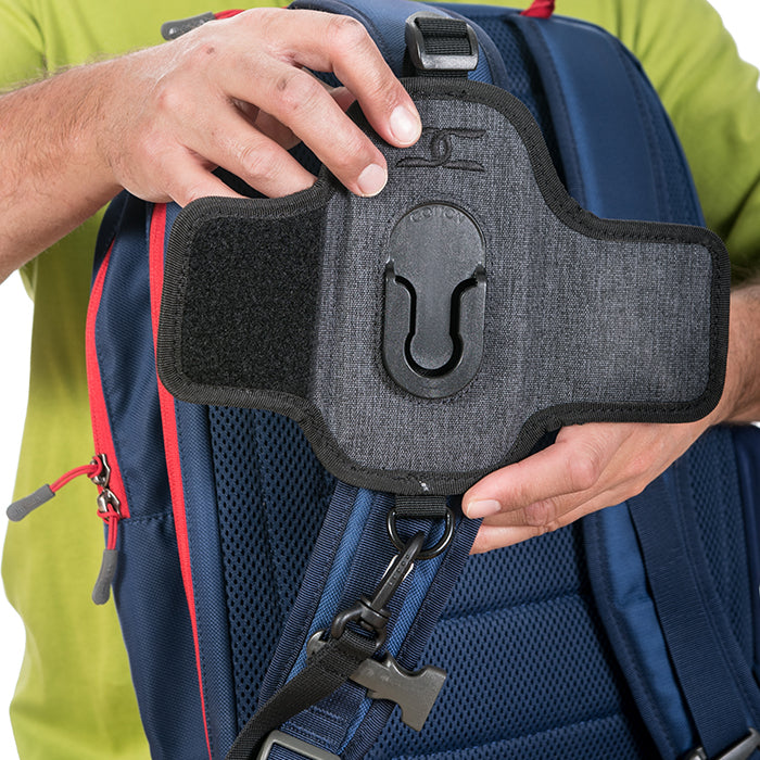 CCS G3 Grey Strapshot camera harness being attached to a backpack strap